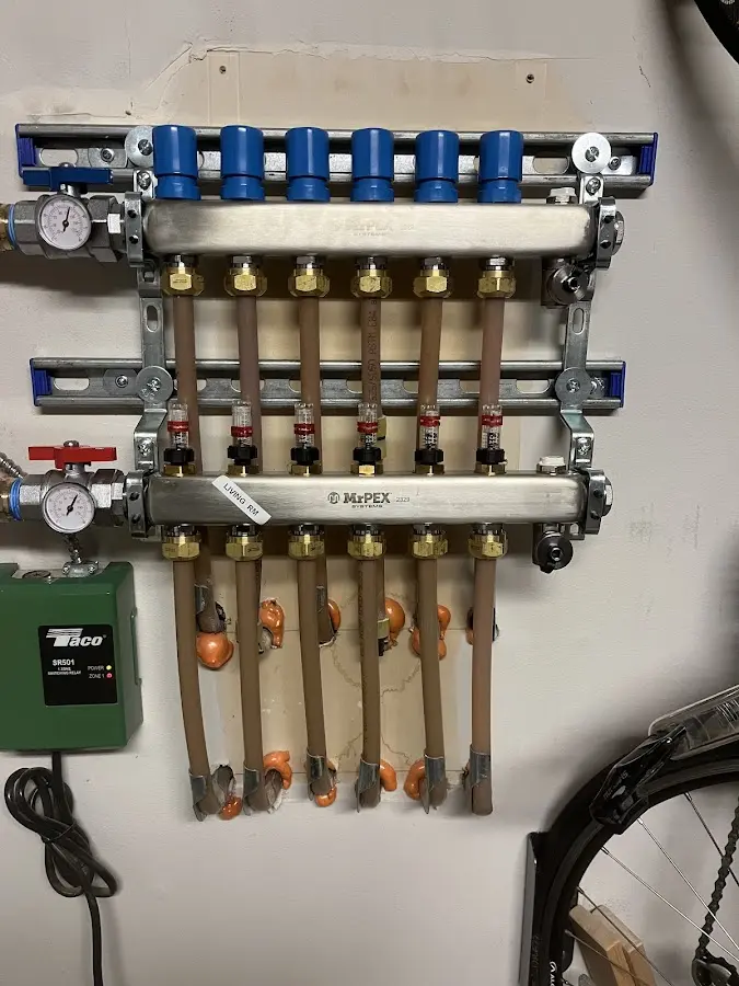 Plumber performing Water Heater Repair at a residential property in Hamilton